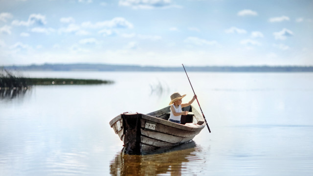 Lake boat man clouds portrait free wallpaper - medium preview image