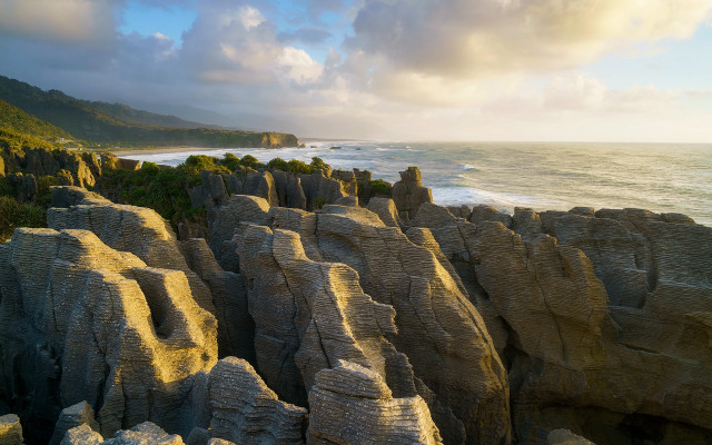 Rocky cliff beach cloudy sky free wallpaper - medium preview image