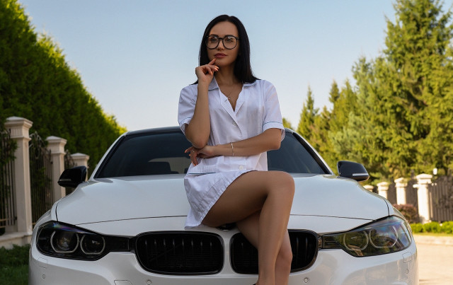 Woman sitting white car posing free wallpaper - medium preview image