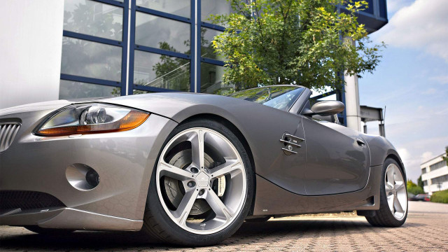 Silver sports car building tree free wallpaper - medium preview image