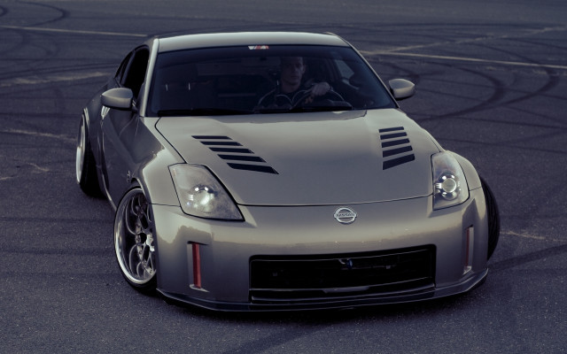 Silver sports car driver night free wallpaper - medium preview image