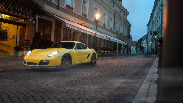 Yellow sports car cobblestone street free wallpaper - medium preview image