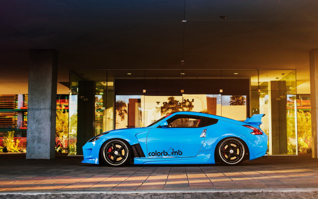 Blue sports car building window free wallpaper - medium preview image