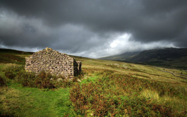 Stone building grassy field cloudy free wallpaper - medium preview image