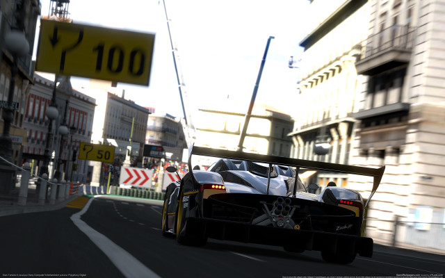 Car street tallbuildings motionblur streetsign free wallpaper - medium preview image