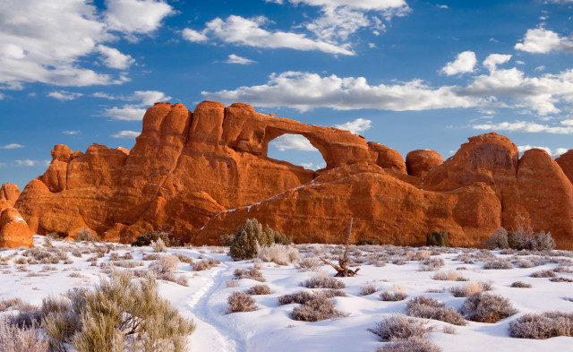Snowy field rock formation blue free wallpaper - medium preview image