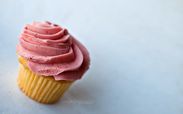 Cupcake pink frosting white surface free wallpaper - medium preview image