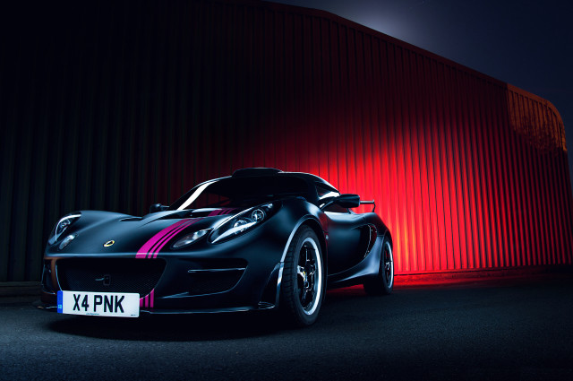 Black sports car red wall free wallpaper - medium preview image