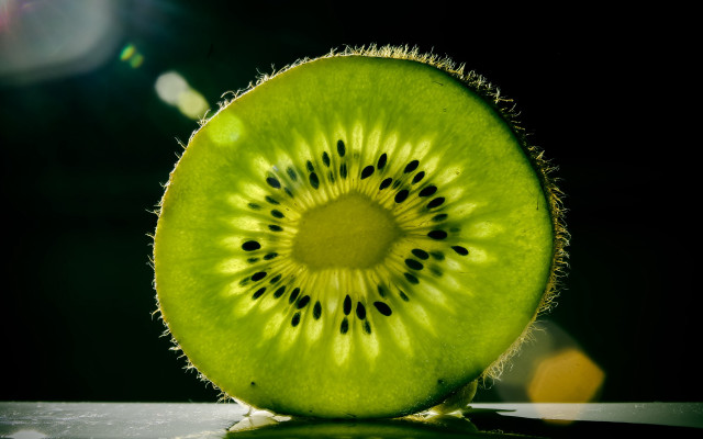 Kiwi slice flat black background free wallpaper - medium preview image