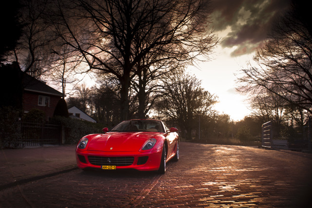 Red sports car cobblestone street #2 free wallpaper - medium preview image