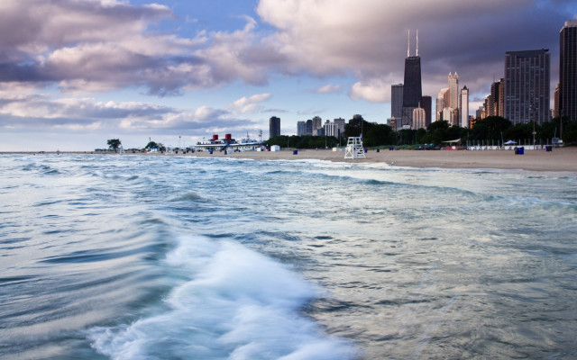 Beach city waves boat sky free wallpaper - medium preview image
