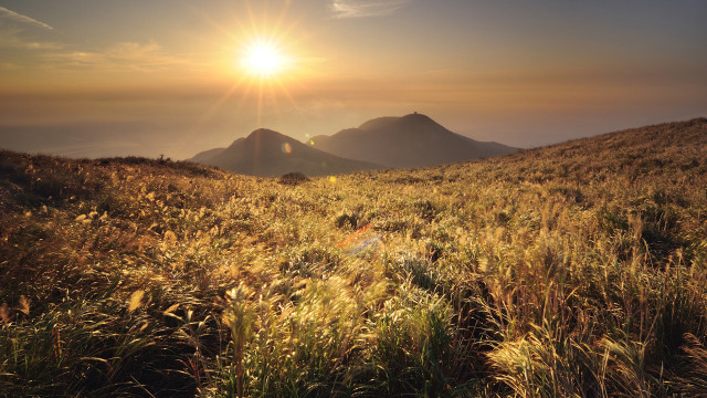 Grassy mountain sunset sunshine horizon free wallpaper - medium preview image