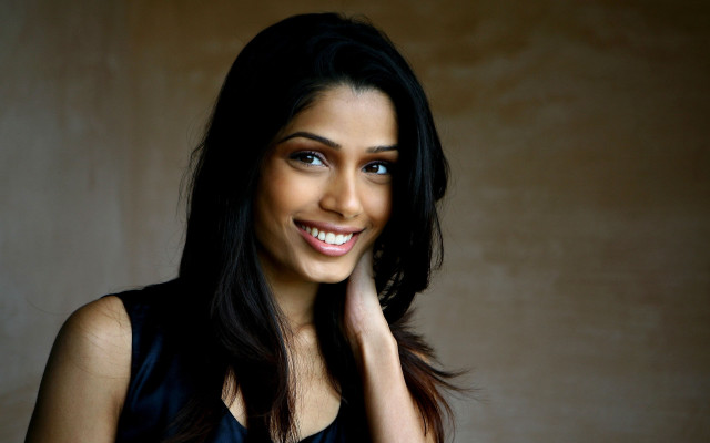 Woman smiling black hair portrait free wallpaper - medium preview image