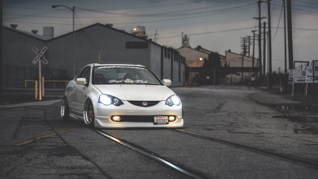 White car parked railroad tracks free wallpaper - medium preview image