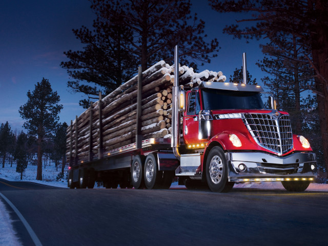 Red semi truck hauling logs free wallpaper - medium preview image