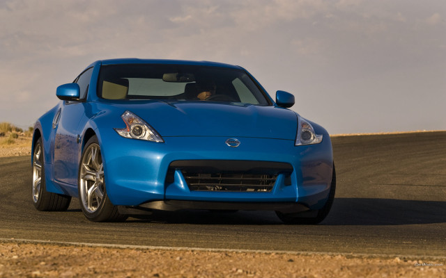 Blue sports car desert road free wallpaper - medium preview image
