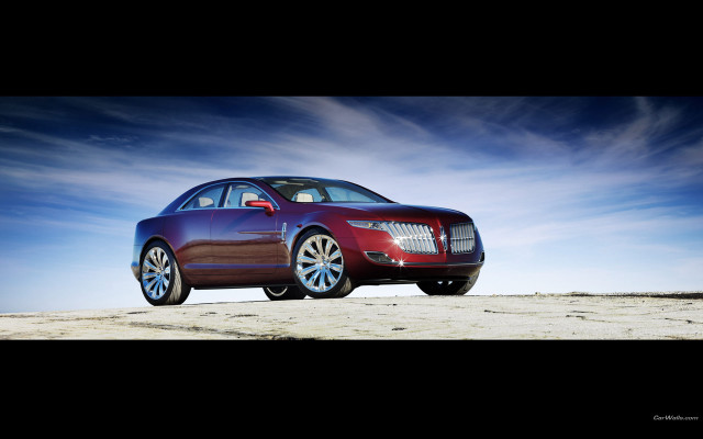 Red car beach blue sky free wallpaper - medium preview image
