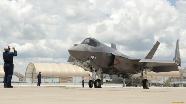 Fighterjet man suit tarmac cloudy free wallpaper - medium preview image