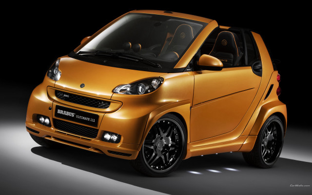Small yellow car dark room free wallpaper for desktop - medium preview image