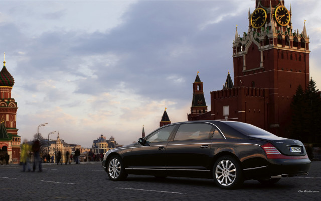 Black car clock tower cityscape free wallpaper - medium preview image