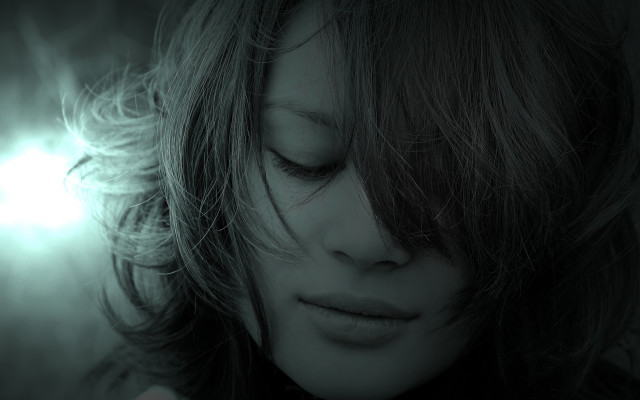 Woman blowing hair dark room free wallpaper - medium preview image