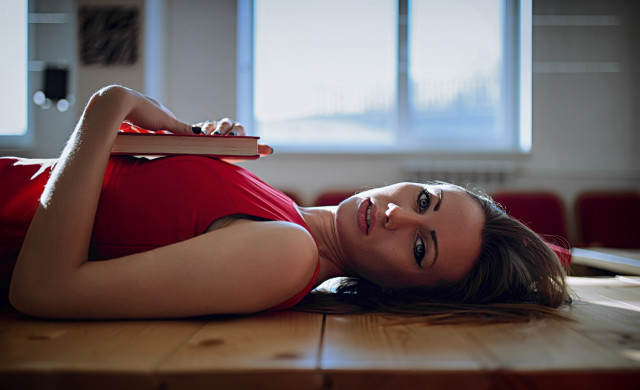 Woman laying book window portrait free wallpaper - medium preview image