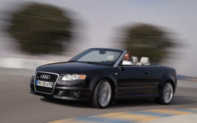 Black convertible driving trees fence free wallpaper - medium preview image