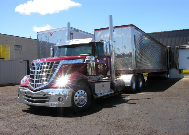 Semi truck parking lot building free wallpaper - medium preview image