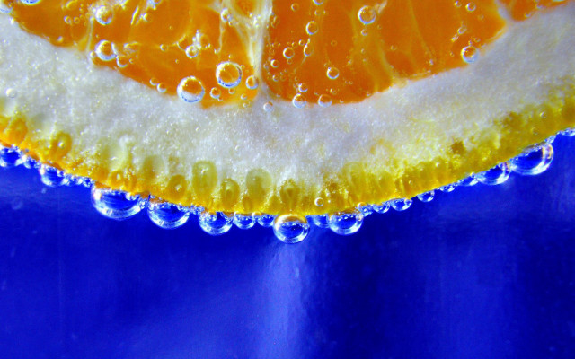 Orange slice water droplets blue free wallpaper - medium preview image