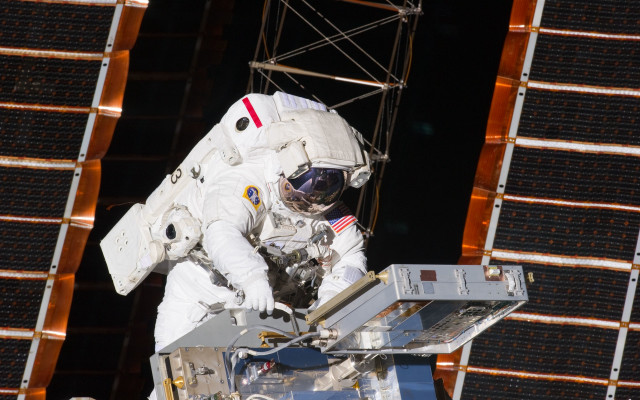 Space suit man working satellite free wallpaper - medium preview image