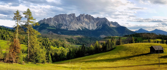 Grassy field house mountains clouds free wallpaper - medium preview image