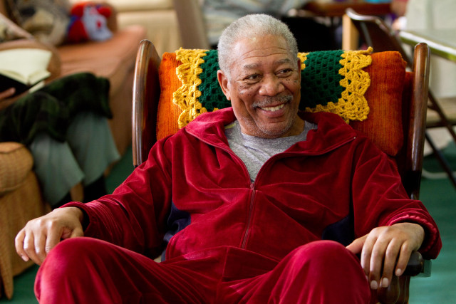 Man red jacket smiling chair free wallpaper - medium preview image