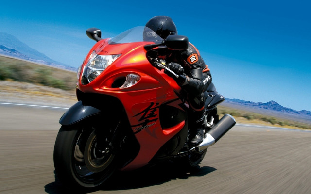 Red motorcycle desert mountains sky free wallpaper - medium preview image