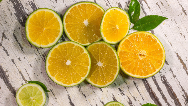 Oranges halved leaves wooden table free wallpaper - medium preview image