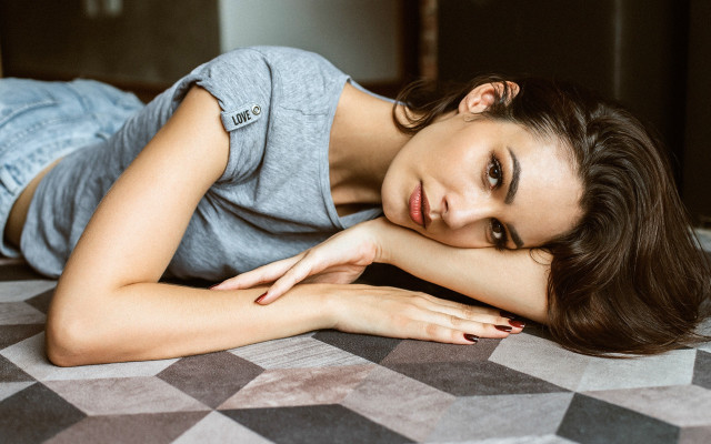 Woman laying on bed argyle free wallpaper - medium preview image