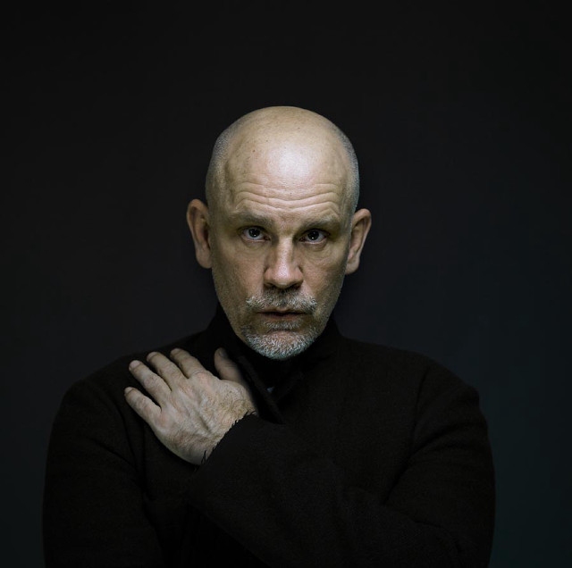 Bald man black shirt hands free wallpaper - medium preview image