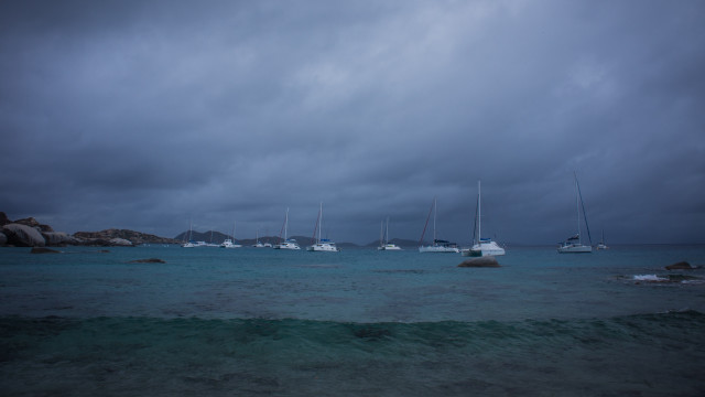 Boats cloudy stormy beach ocean free wallpaper - medium preview image