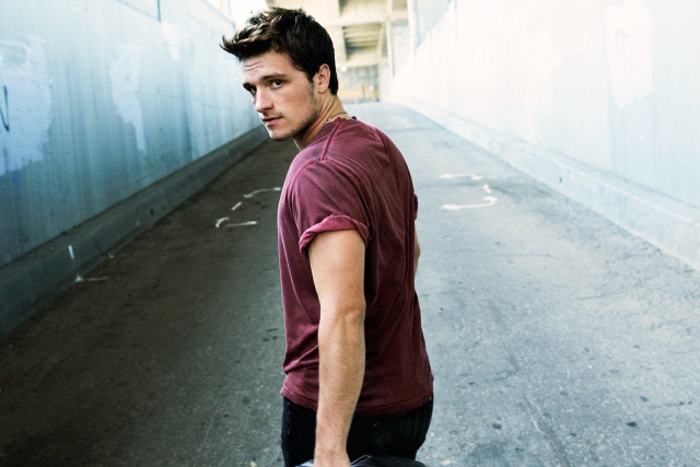 Man holding skateboard narrow alley free wallpaper - medium preview image