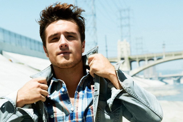 Man holding jacket shoulder outside free wallpaper - medium preview image