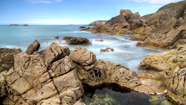 Rocky beach water rocks sky free wallpaper - medium preview image