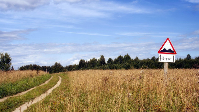 Road sign field trees clouds free wallpaper - medium preview image