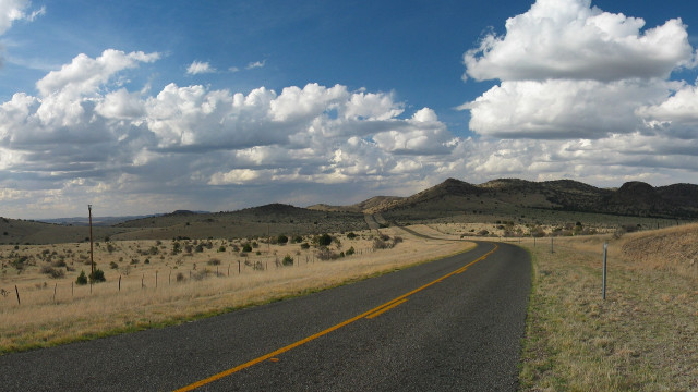 Road field mountains clouds sky free wallpaper - medium preview image
