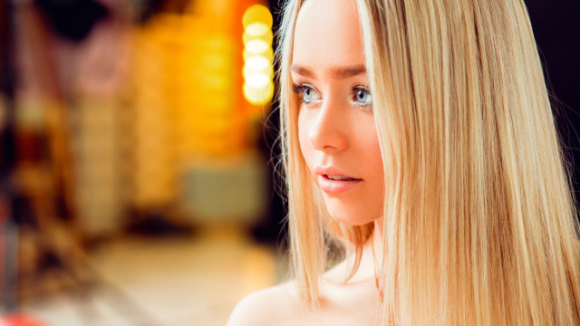 Blonde woman serious eyes blurry free wallpaper - medium preview image