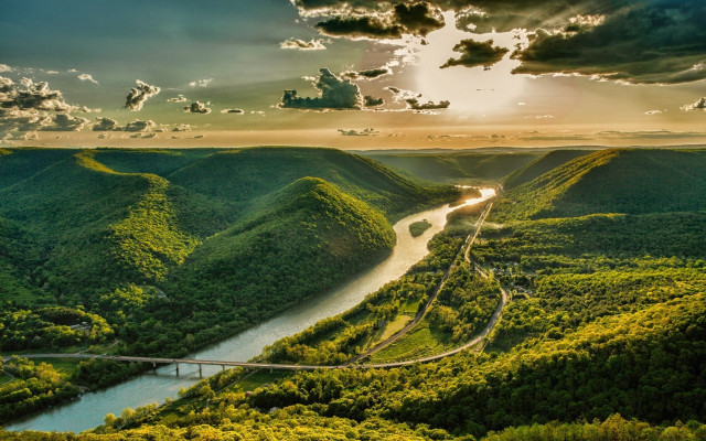 Lush green valley river sunrays free wallpaper - medium preview image