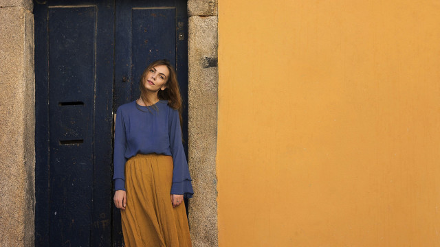 Woman standing door blue shirt free wallpaper - medium preview image