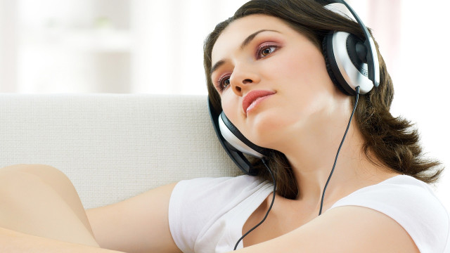 Woman headphones couch relaxing asian free wallpaper - medium preview image