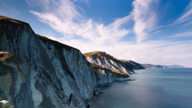 Cliff water blue sky clouds free wallpaper - medium preview image