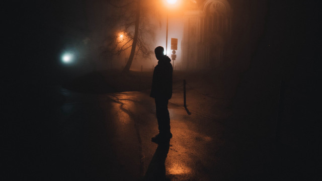 Man standing night fog streetlight free wallpaper - medium preview image