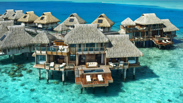 Waterhouses beachroof chairs umbrellas architecture free wallpaper - medium preview image