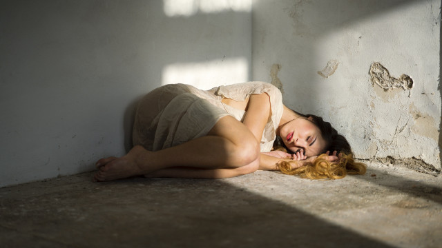Woman lying floor window behind free wallpaper - medium preview image